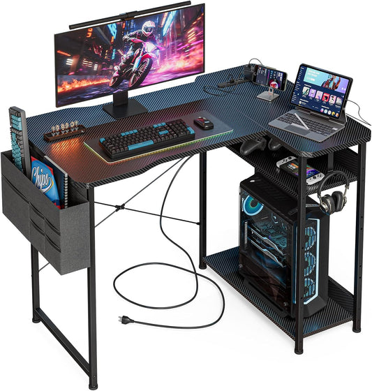 Escritorio de Gaming en Forma de L de 40 Pulgadas - Escritorio de Esquina para Computadora con Tomas de Corriente, Estantes Reversibles y Bolsa de Almacenamiento para Oficina en Casa, Mesa de Gaming para PC